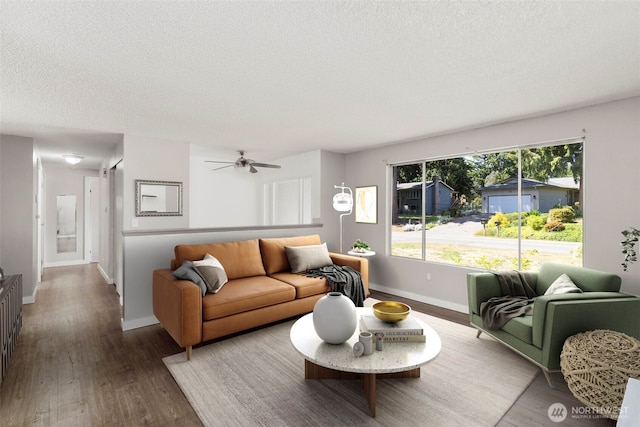 8539 University Point Cir NE, Bremerton, WA 98311 - living area featuring a textured ceiling, wood finished floors, baseboards, and ceiling fan