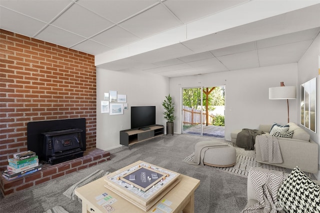 8539 University Point Cir NE, Bremerton, WA 98311 - carpeted living area with a wood stove and a paneled ceiling