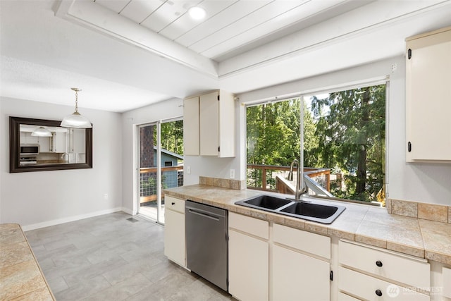 8539 University Point Cir NE, Bremerton, WA 98311 - kitchen featuring stainless steel appliances, a sink, tile counters, hanging light fixtures, and baseboards