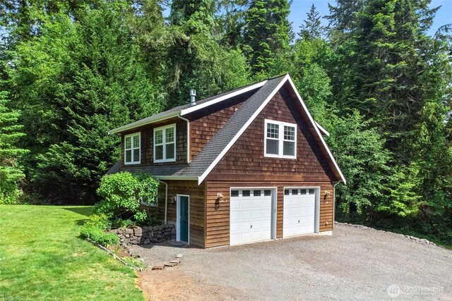 8000 NE W Port Madison Rd, Bainbridge Island, WA 98110 - view of front of house with a garage, a front yard, and roof with shingles