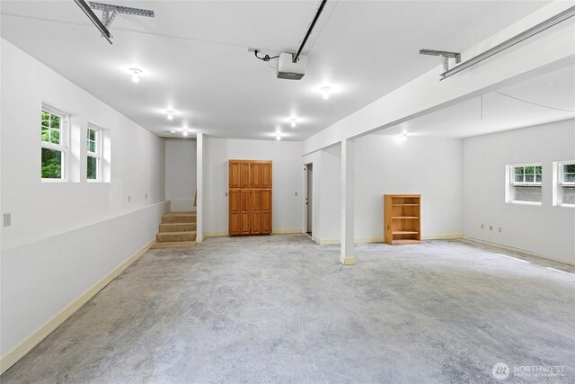 8000 NE W Port Madison Rd, Bainbridge Island, WA 98110 - garage with a garage door opener and baseboards