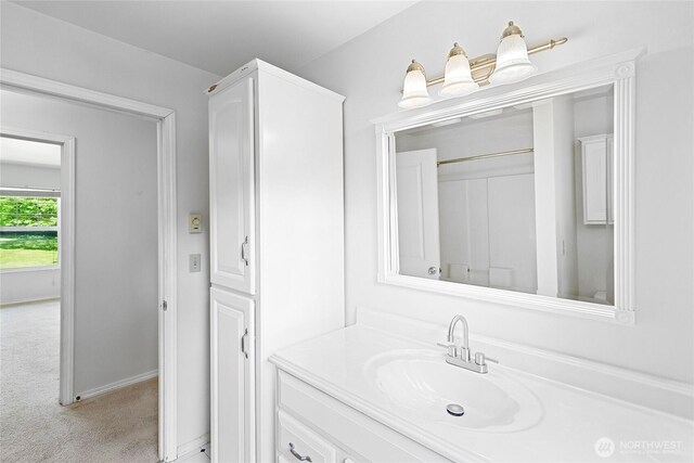 8000 NE W Port Madison Rd, Bainbridge Island, WA 98110 - bathroom with vanity and baseboards