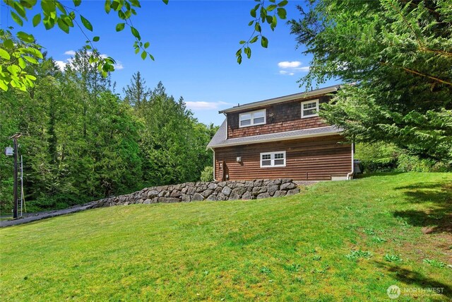 8000 NE W Port Madison Rd, Bainbridge Island, WA 98110 - view of property exterior with a yard
