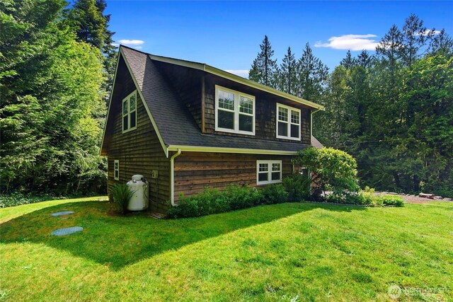 8000 NE W Port Madison Rd, Bainbridge Island, WA 98110 - view of side of home with a lawn