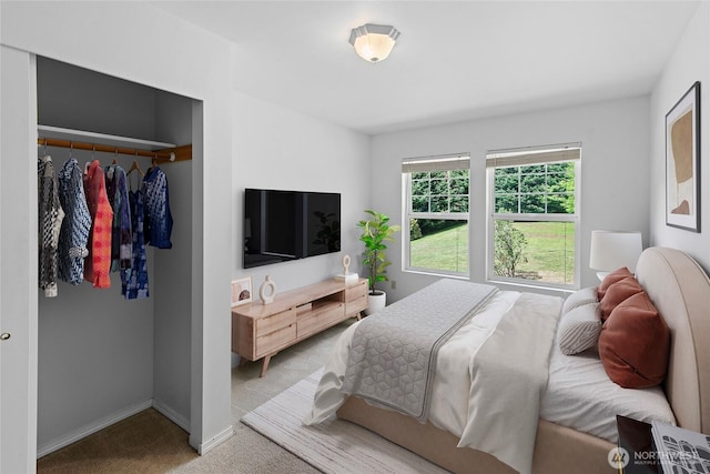 8000 NE W Port Madison Rd, Bainbridge Island, WA 98110 - bedroom featuring light colored carpet, a closet, and baseboards