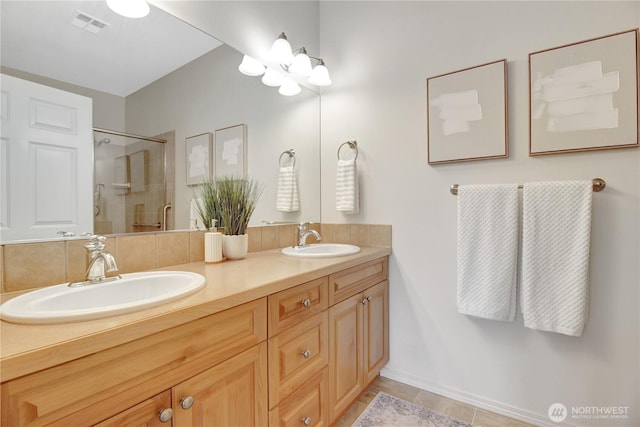 910 Medical Center Dr Unit E101, Arlington, WA 98223 - bathroom featuring double vanity, a shower stall, tile patterned floors, and baseboards