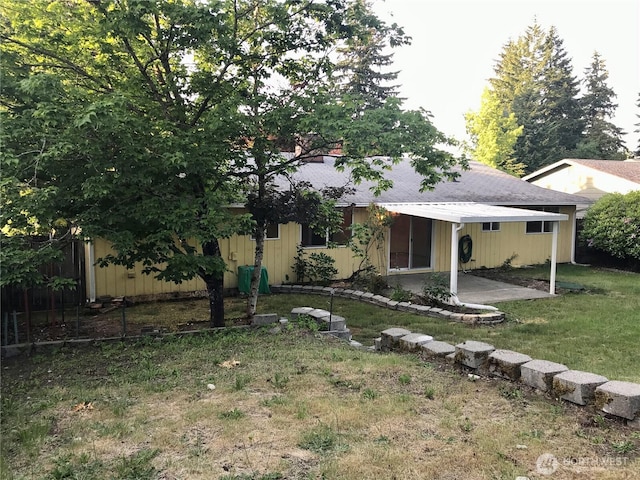 7613 12th Way, Olympia, WA 98516 - view of front of home with a patio, a front lawn, and roof with shingles
