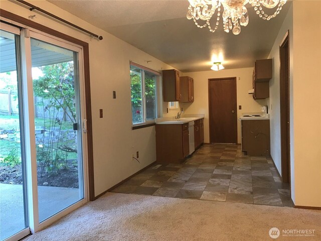 7613 12th Way, Olympia, WA 98516 - kitchen with dishwasher, a chandelier, light countertops, and dark carpet