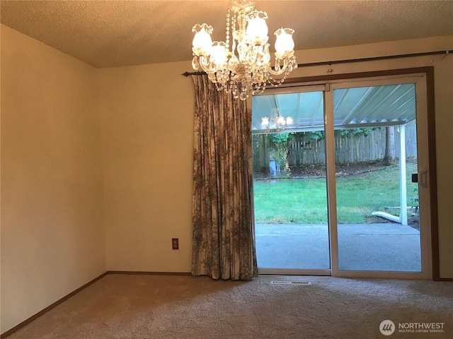 7613 12th Way, Olympia, WA 98516 - entryway with carpet flooring, a chandelier, baseboards, and a textured ceiling