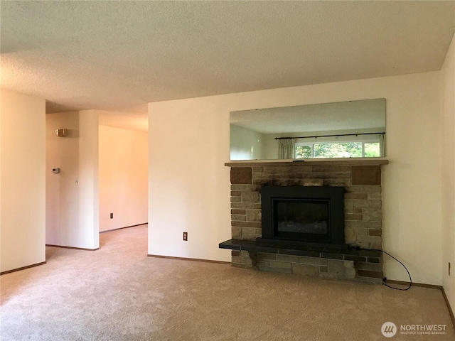 7613 12th Way, Olympia, WA 98516 - unfurnished living room featuring carpet floors, a fireplace, baseboards, and a textured ceiling