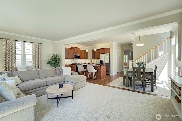 24817 SE 13th Pl, Sammamish, WA 98075 - living area featuring stairs, crown molding, dark wood-style flooring, and baseboards