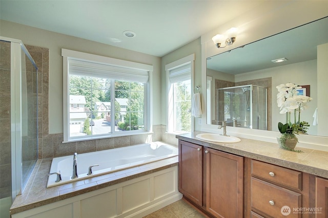 24817 SE 13th Pl, Sammamish, WA 98075 - full bathroom with vanity, a stall shower, a garden tub, and tile patterned flooring