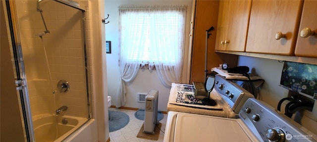 324 Pond Ln, Sequim, WA 98382 - bathroom featuring bath / shower combo with glass door, washing machine and clothes dryer, and tile patterned floors