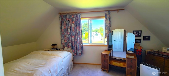 324 Pond Ln, Sequim, WA 98382 - bedroom with vaulted ceiling, light carpet, and baseboards