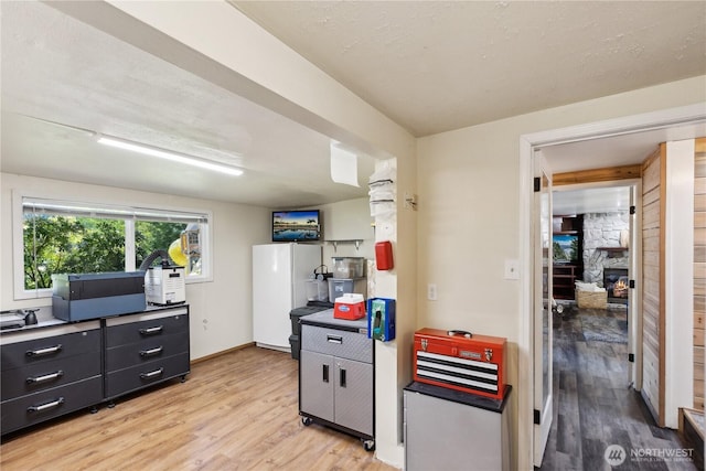 31707 W Lake Ketchum Rd, Stanwood, WA 98292 - kitchen featuring light wood-style flooring, freestanding refrigerator, and baseboards