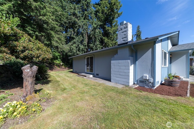 15310 25th St E, Tacoma, WA 98445 - view of home's exterior with a chimney and a yard