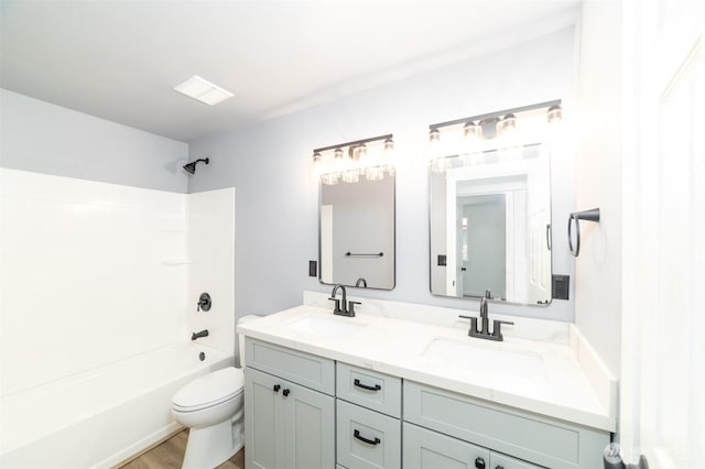 15310 25th St E, Tacoma, WA 98445 - full bath featuring double vanity, toilet, shower / washtub combination, and wood finished floors