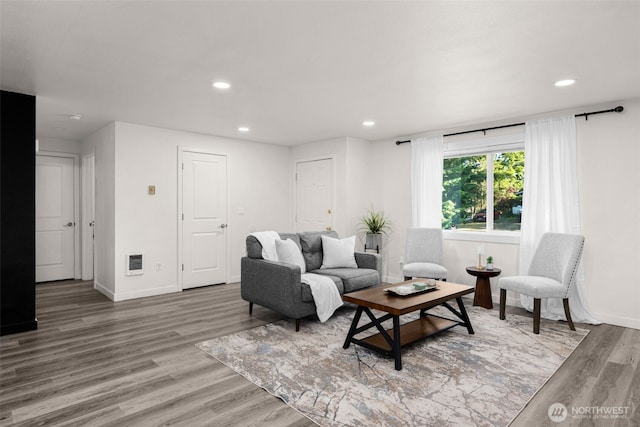 8517 188th Ct E, Puyallup, WA 98375 - living area featuring wood finished floors, recessed lighting, baseboards, and heating unit