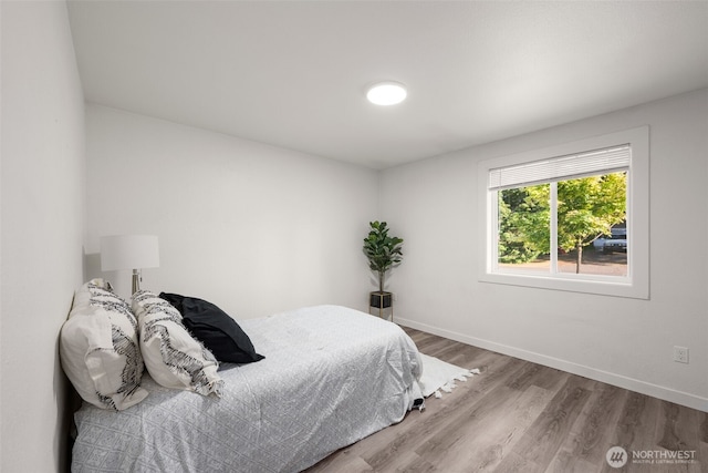 8517 188th Ct E, Puyallup, WA 98375 - bedroom with wood finished floors and baseboards