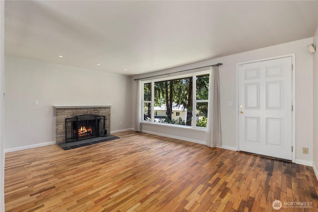 4006 147th Pl SE, Bellevue, WA 98006 - unfurnished living room featuring wood finished floors, baseboards, a fireplace, and recessed lighting
