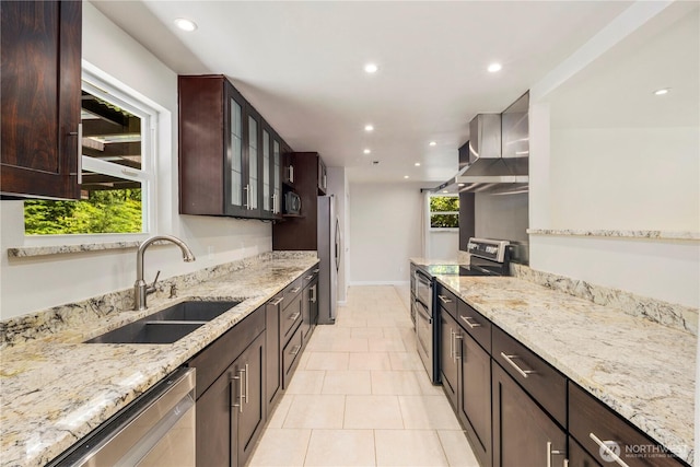 4006 147th Pl SE, Bellevue, WA 98006 - kitchen with appliances with stainless steel finishes, a sink, recessed lighting, light stone countertops, and dark brown cabinetry