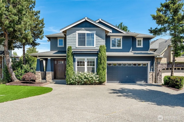 3623 148th St SE, Mill Creek, WA 98012 - craftsman house with driveway, stone siding, an attached garage, and a shingled roof