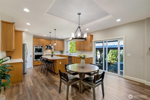 3623 148th St SE, Mill Creek, WA 98012 - dining area with recessed lighting, wood finished floors, a raised ceiling, baseboards, and a chandelier