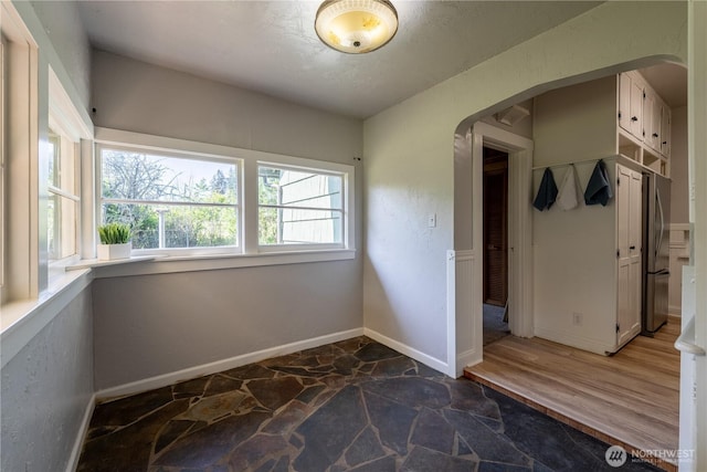 18005 Burn Rd, Arlington, WA 98223 - mudroom featuring arched walkways and stone flooring