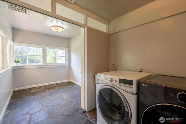 18005 Burn Rd, Arlington, WA 98223 - laundry area with stone floors and separate washer and dryer