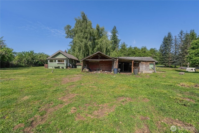 18005 Burn Rd, Arlington, WA 98223 - view of green lawn featuring an outdoor structure