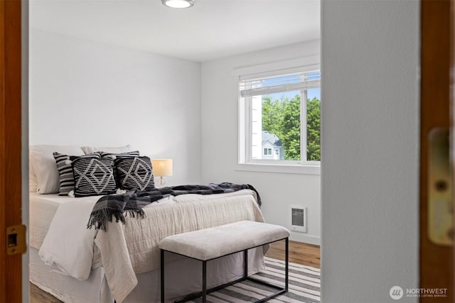 4243 Wintergreen Cir Unit 136, Bellingham, WA 98226 - bedroom with wood finished floors, baseboards, heating unit, and recessed lighting
