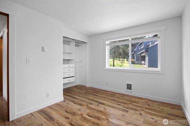 4243 Wintergreen Cir Unit 136, Bellingham, WA 98226 - unfurnished bedroom featuring wood finished floors, baseboards, and a closet