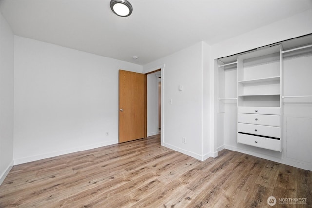 4243 Wintergreen Cir Unit 136, Bellingham, WA 98226 - unfurnished bedroom with light wood-style floors, baseboards, and a closet