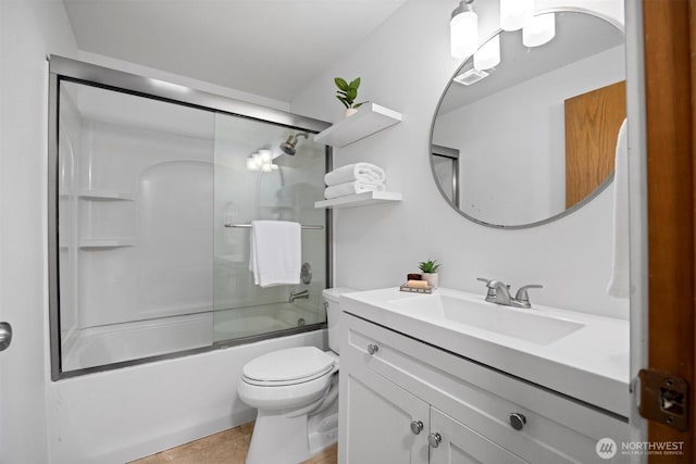 4243 Wintergreen Cir Unit 136, Bellingham, WA 98226 - bathroom with vanity, toilet, bath / shower combo with glass door, and tile patterned flooring