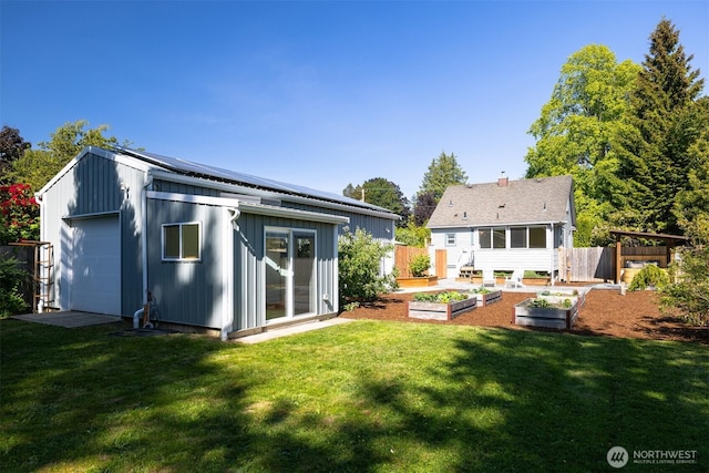 2921 Ellis St, Bellingham, WA 98225 - rear view of house featuring a garden, an outbuilding, and board and batten siding