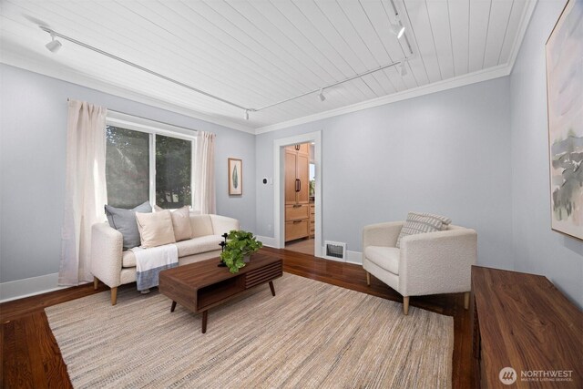 2921 Ellis St, Bellingham, WA 98225 - living room featuring rail lighting, wood finished floors, baseboards, and crown molding