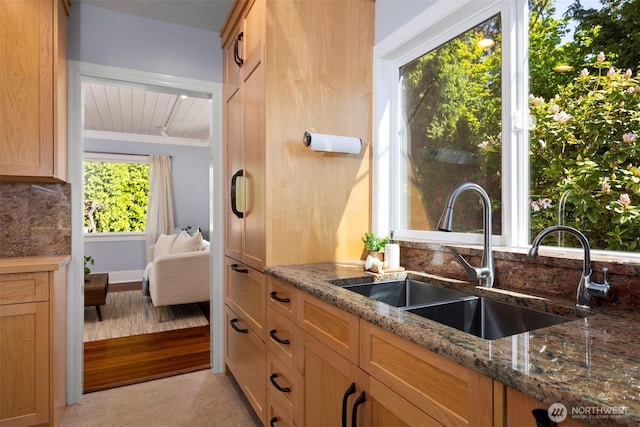 2921 Ellis St, Bellingham, WA 98225 - kitchen featuring a sink, dark stone countertops, tasteful backsplash, and light brown cabinetry