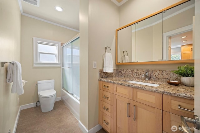 2921 Ellis St, Bellingham, WA 98225 - bathroom featuring baseboards, ornamental molding, vanity, toilet, and enclosed tub / shower combo