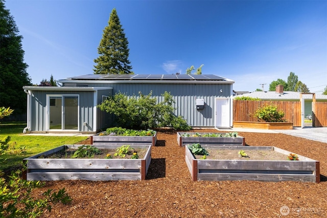 2921 Ellis St, Bellingham, WA 98225 - rear view of property with a vegetable garden and solar panels