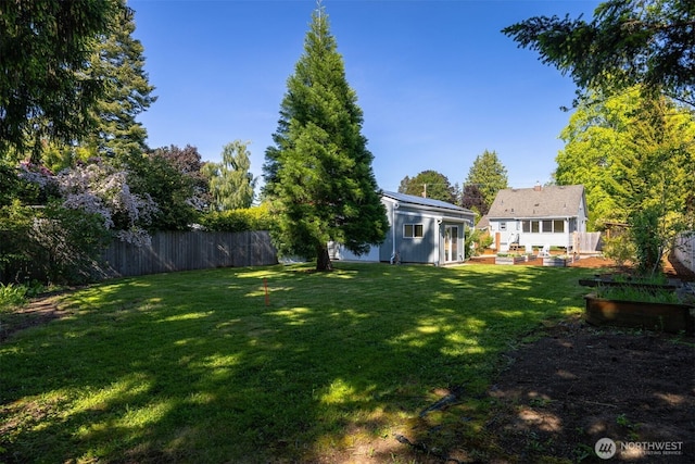 2921 Ellis St, Bellingham, WA 98225 - view of yard featuring a garden and an outbuilding