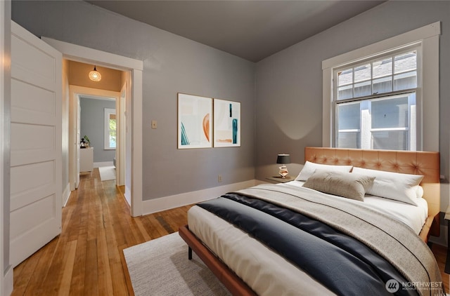 914 N Cedar St, Tacoma, WA 98406 - bedroom with light wood-type flooring and baseboards