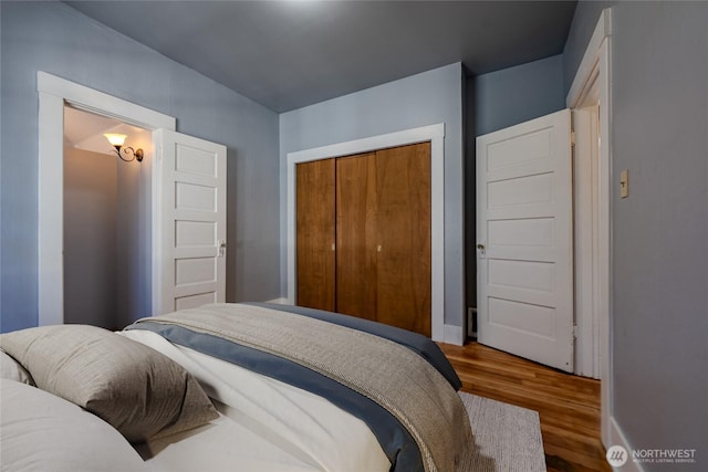 914 N Cedar St, Tacoma, WA 98406 - bedroom featuring wood finished floors, a closet, and baseboards