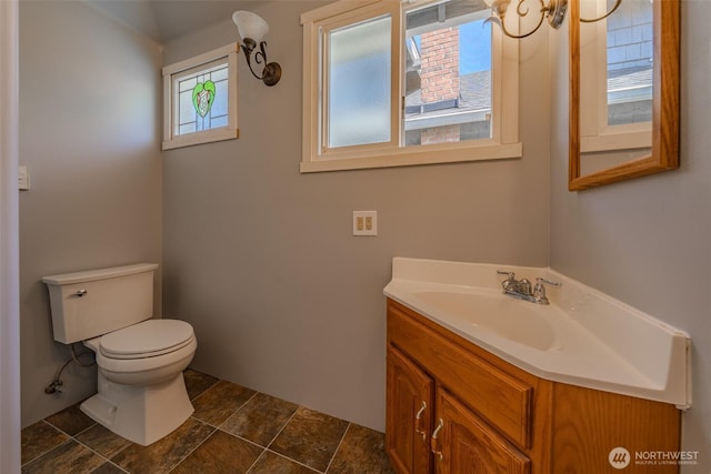 914 N Cedar St, Tacoma, WA 98406 - bathroom with toilet, vanity, and stone finish flooring