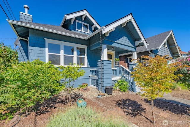 914 N Cedar St, Tacoma, WA 98406 - view of front facade with roof with shingles, a chimney, and a porch