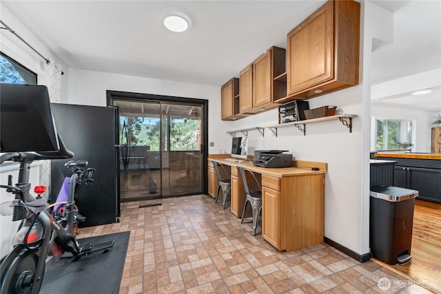 5721 Mountain Lane Rd, Peshastin, WA 98847 - kitchen featuring open shelves, brick patterned flooring, light countertops, brown cabinets, and baseboards
