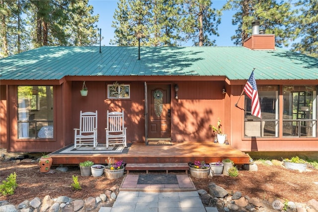 5721 Mountain Lane Rd, Peshastin, WA 98847 - rustic home with metal roof, a chimney, and a deck