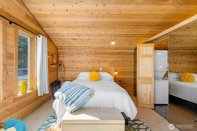 44019 Fir Rd, Gold Bar, WA 98251 - bedroom with estacked washer and dryer, vaulted ceiling, wooden ceiling, wood walls, and carpet flooring