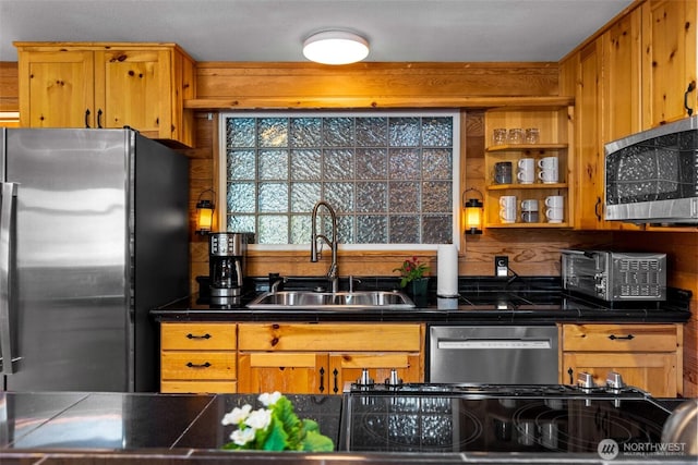 44019 Fir Rd, Gold Bar, WA 98251 - kitchen featuring stainless steel appliances, a sink, dark countertops, and brown cabinets