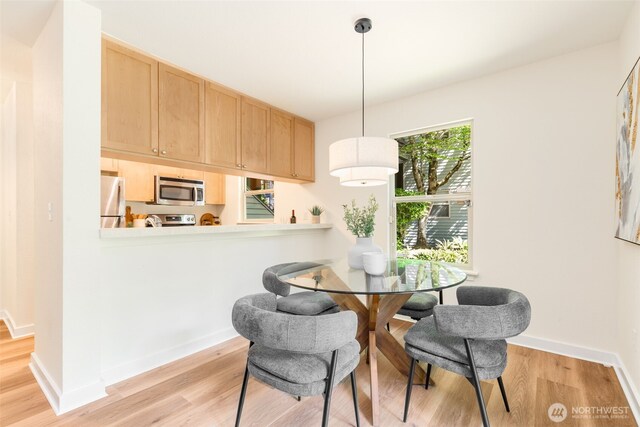 9805 Avondale Rd NE Unit M139, Redmond, WA 98052 - dining space featuring light wood-type flooring and baseboards