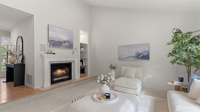 11405 SE 65th St, Bellevue, WA 98006 - carpeted living area featuring a fireplace, a towering ceiling, and baseboards